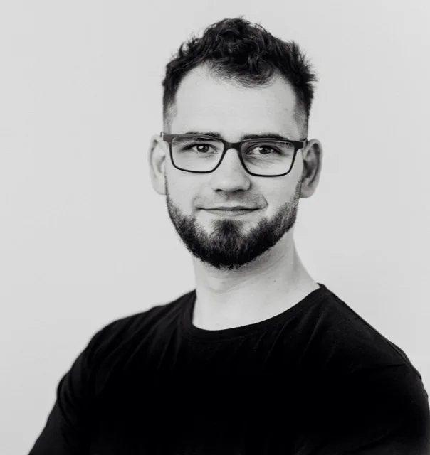 Professional portrait of Maciej Szymczak.